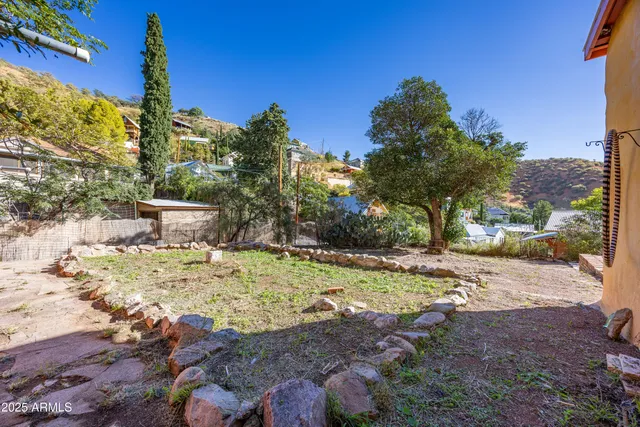 a view of backyard with a patio