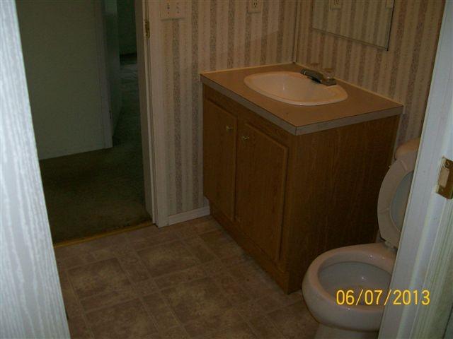168 Wilson Cemetery Road Northeast Check, VA 24072 - Photo 7 of 14 a bathroom with a sink and a mirror