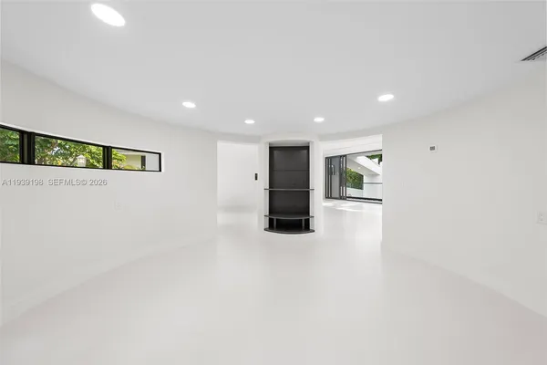 a view of a room with a large window