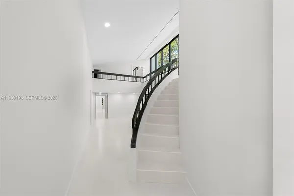 a utility room with sink dryer and washer