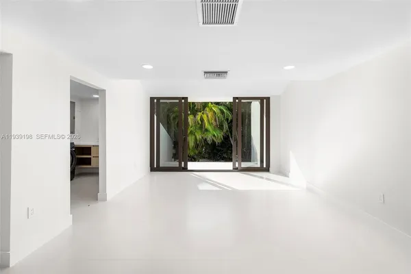 a bathroom with a granite countertop sink mirror and shower