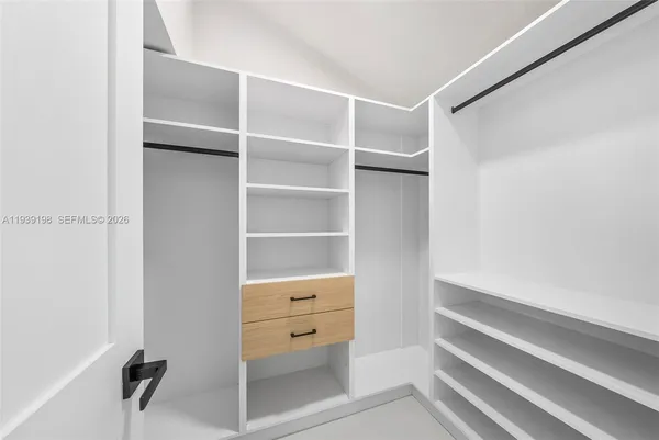 a view of an empty walk in closet