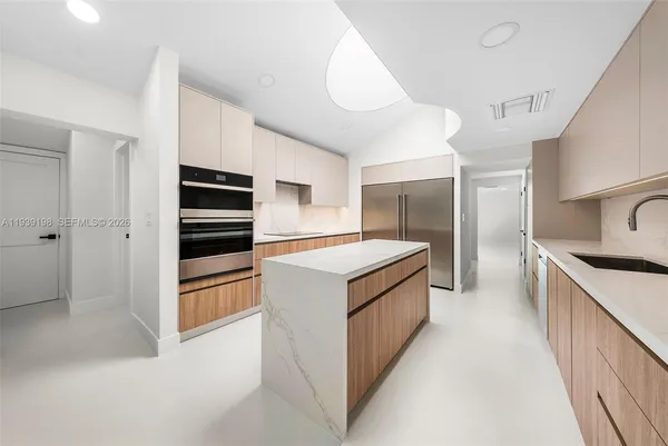 a kitchen with stainless steel appliances a stove and a refrigerator