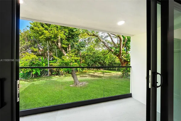 a view of a bathroom with a tub and shower