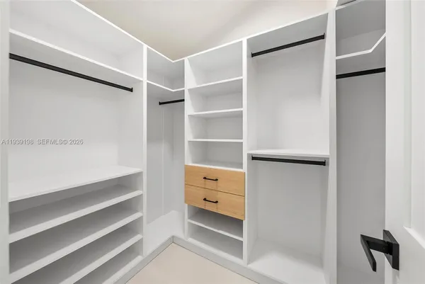 a view of an empty room with a large window