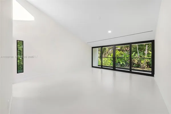 a view of a hallway with stairs