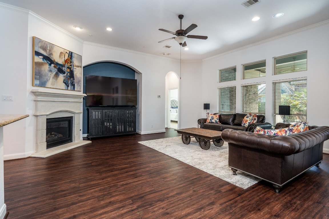6859 Adrienne Arbor Drive Spring, TX 77389 - Photo 10 of 32 Spacious living room with large windows for natural lighting and cozy gas log fireplace