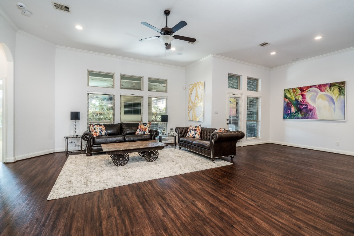 6859 Adrienne Arbor Drive Spring, TX 77389 - Photo 13 of 32 Spacious living room with large windows for natural lighting and cozy gas log fireplace