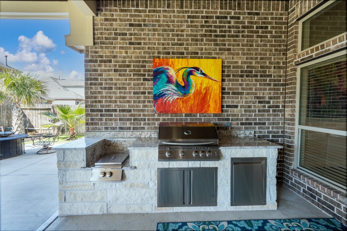 6859 Adrienne Arbor Drive Spring, TX 77389 - Photo 26 of 32 Outdoor kitchen with granite counter tops