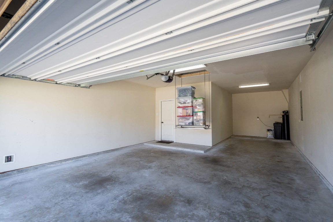 6859 Adrienne Arbor Drive Spring, TX 77389 - Photo 30 of 32 Tandem garage with a pulley system for attic storage