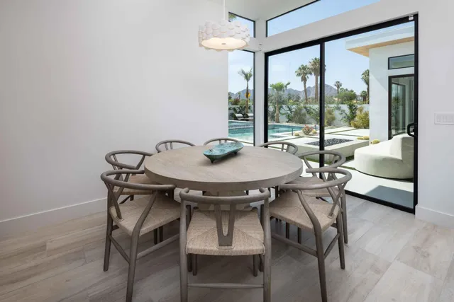 a view of a dining room with furniture window and outside view