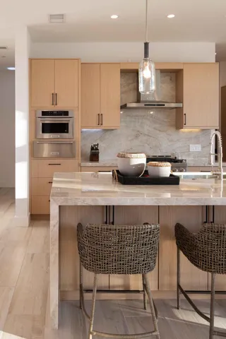 a kitchen with a sink cabinets and window