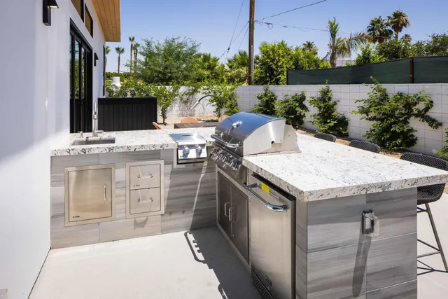 a terrace with a sink and a lake view