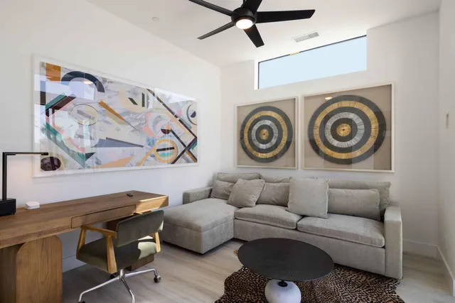 a living room with a couch and cabinets