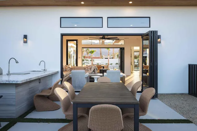 a view of a dining room with furniture window and outside view
