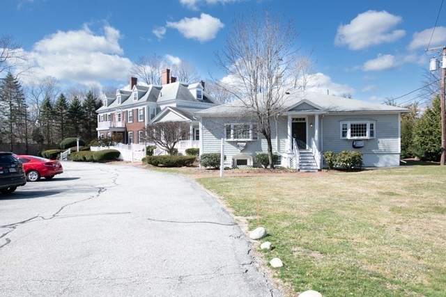 5 Porter Road, Unit 102 Andover, MA 01810 - Photo 24 of 26 a front view of a building with cars parked