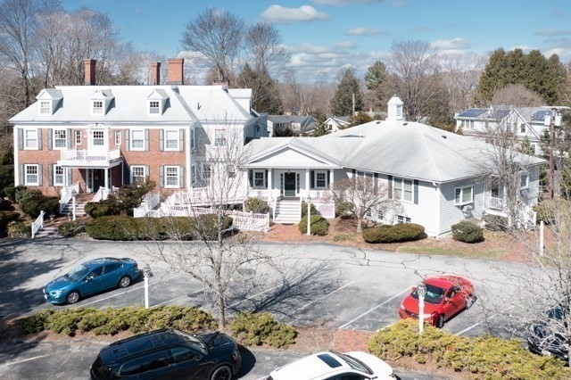 5 Porter Road, Unit 102 Andover, MA 01810 - Photo 4 of 26 a view of a patio with swimming pool table and chairs