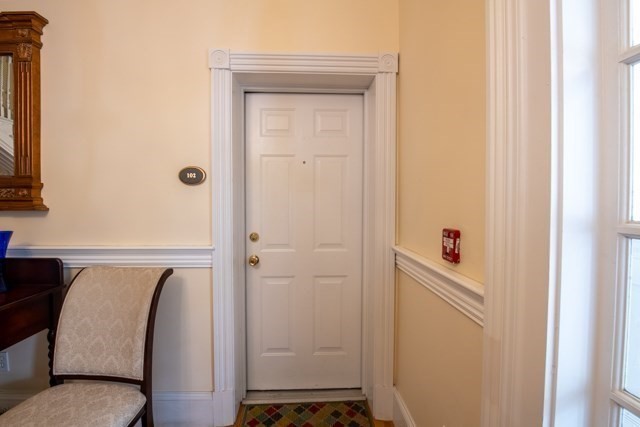 5 Porter Road, Unit 102 Andover, MA 01810 - Photo 7 of 26 a view of a bedroom with a wardrobe