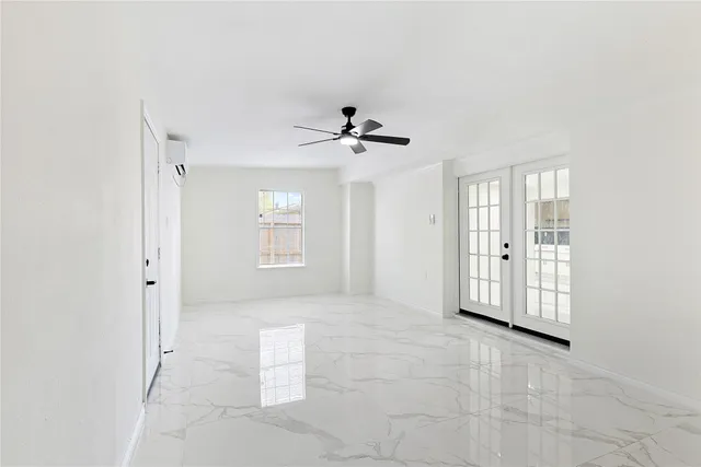 a large white kitchen with a sink and dishwasher a refrigerator with white cabinets