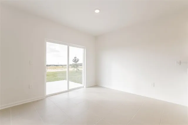 an empty room with glass door