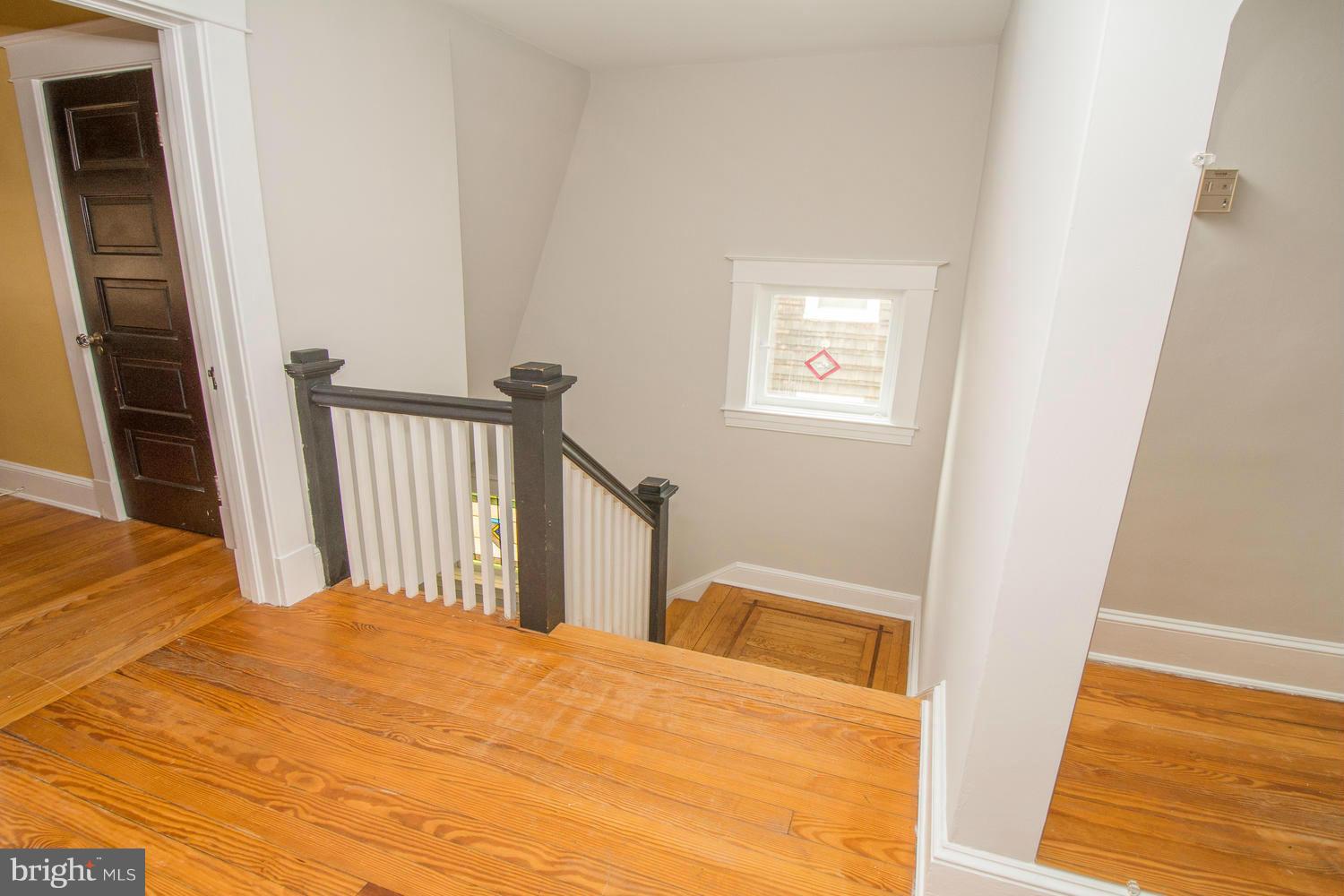 10 Mallow Hill Road Baltimore, MD 21229 - Photo 17 of 30 a bedroom with a bed and wooden floor