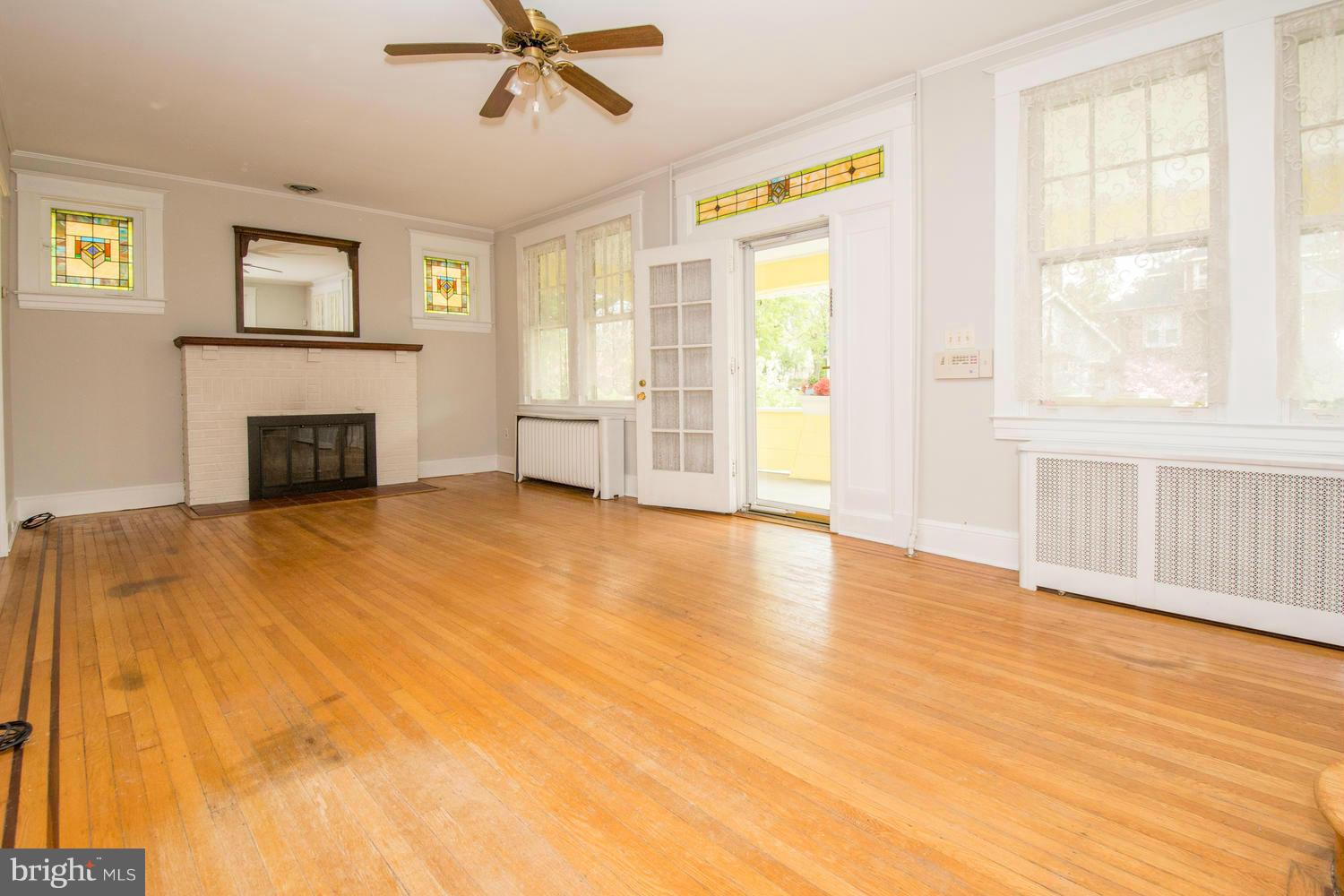 10 Mallow Hill Road Baltimore, MD 21229 - Photo 5 of 30 a view of empty room with fireplace and windows