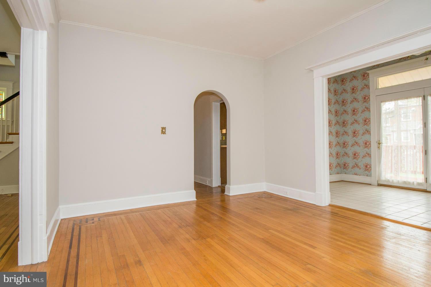 10 Mallow Hill Road Baltimore, MD 21229 - Photo 6 of 30 an empty room with wooden floor and a window