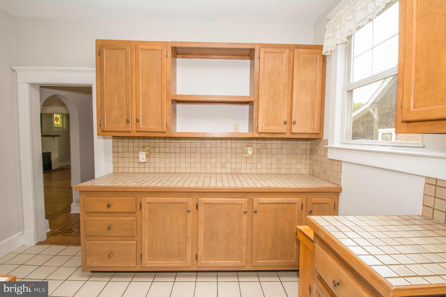 10 Mallow Hill Road Baltimore, MD 21229 - Photo 10 of 30 a kitchen with a cabinets and window