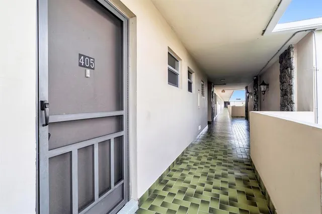 a view of a room that has a bed and a closet in it