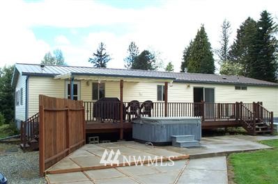 8720 Delta Line Road Custer, WA 98240 - Photo 1 of 1 a view of a house with a tub and wooden fence