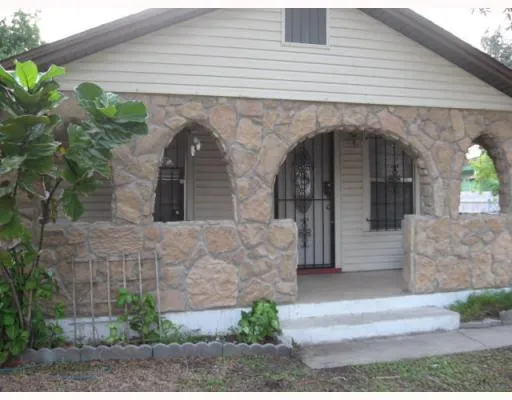 a front view of a house with a garage