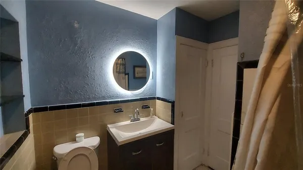 a bathroom with a sink and a toilet