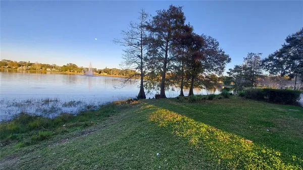 a view of a lake with houses in the back