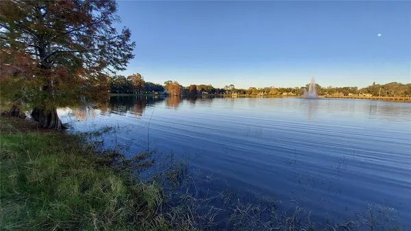 a view of a lake with houses in background
