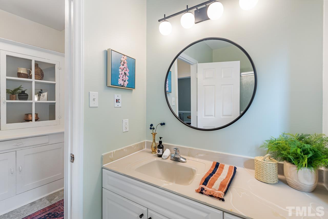 2201 University Drive Durham, NC 27707 - Photo 15 of 43 a bathroom with a sink and a mirror