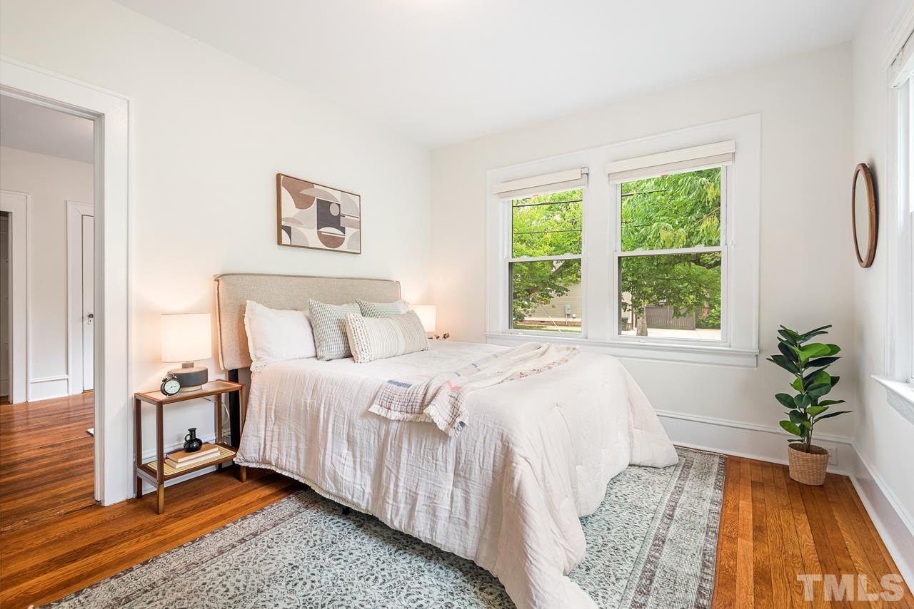 2201 University Drive Durham, NC 27707 - Photo 23 of 43 a bedroom with a bed and a potted plant