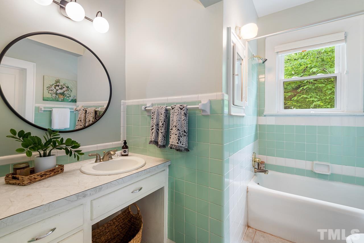 2201 University Drive Durham, NC 27707 - Photo 30 of 43 a bathroom with a sink and a mirror