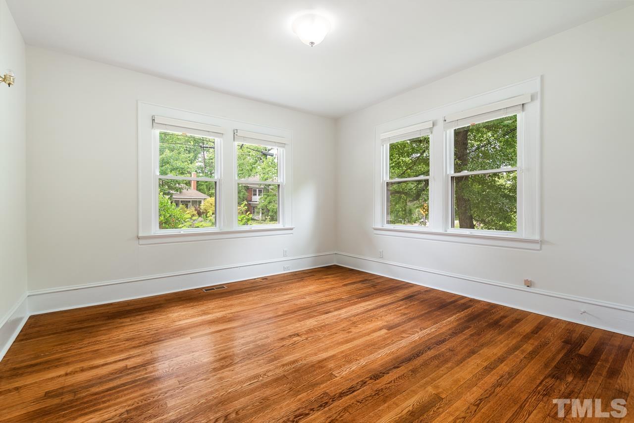 2201 University Drive Durham, NC 27707 - Photo 34 of 43 a view of an empty room with wooden floor and a window