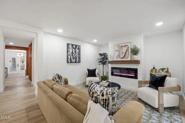 a living room with furniture and a table