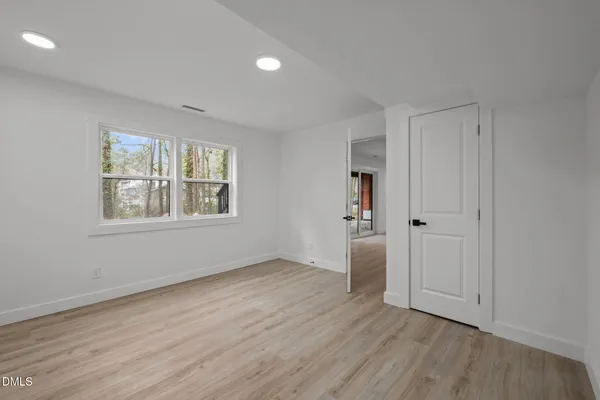 a view of deck with a large window and wooden floor