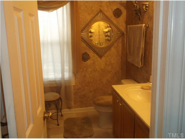 2204 Tucca Way Raleigh, NC 27604 - Photo 13 of 17 a bathroom with a sink and mirror