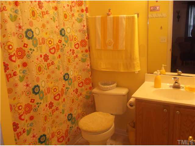 2204 Tucca Way Raleigh, NC 27604 - Photo 15 of 17 a bathroom with a sink and a toilet