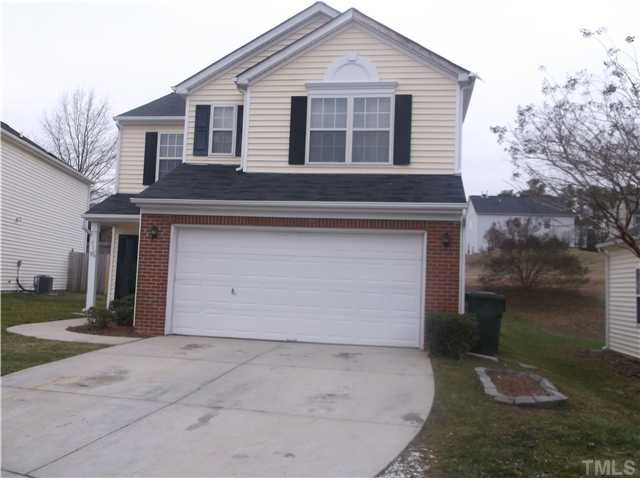 2204 Tucca Way Raleigh, NC 27604 - Photo 2 of 17 a front view of a house with a yard and garage