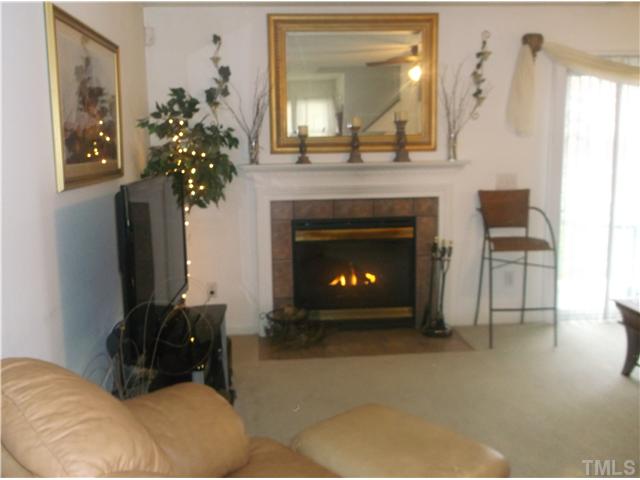2204 Tucca Way Raleigh, NC 27604 - Photo 6 of 17 a living room with furniture and a fireplace