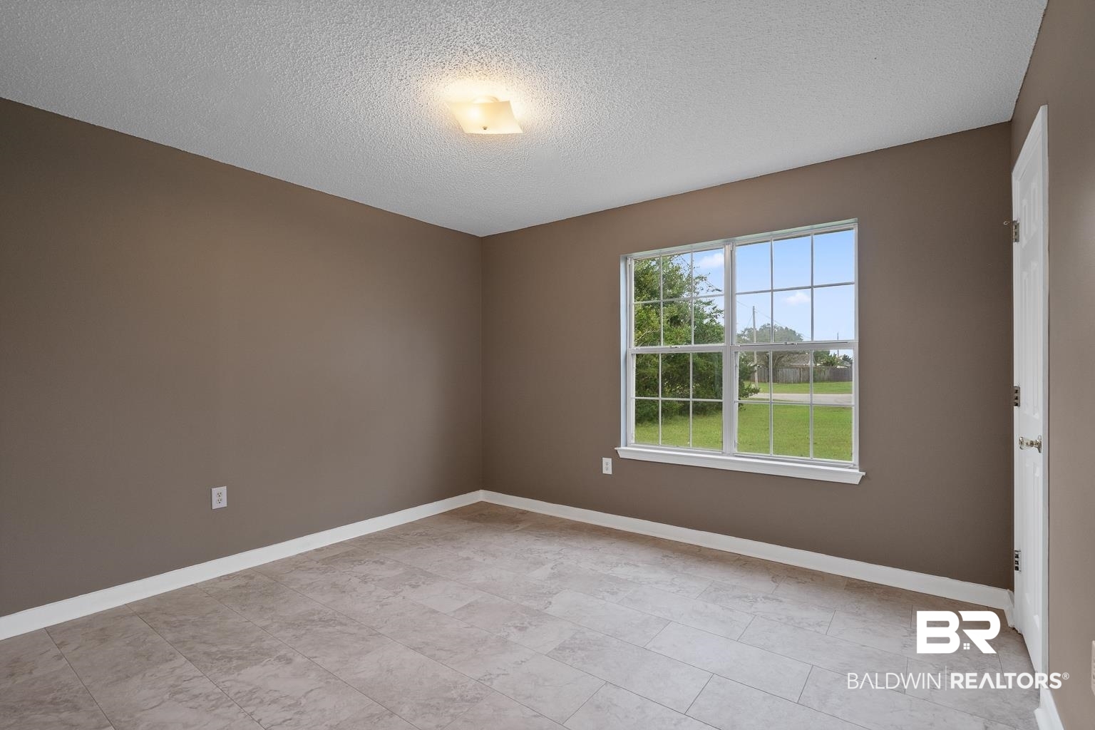 16418 Avent Lane Foley, AL 36535 - Photo 28 of 30 Spare room with a textured ceiling