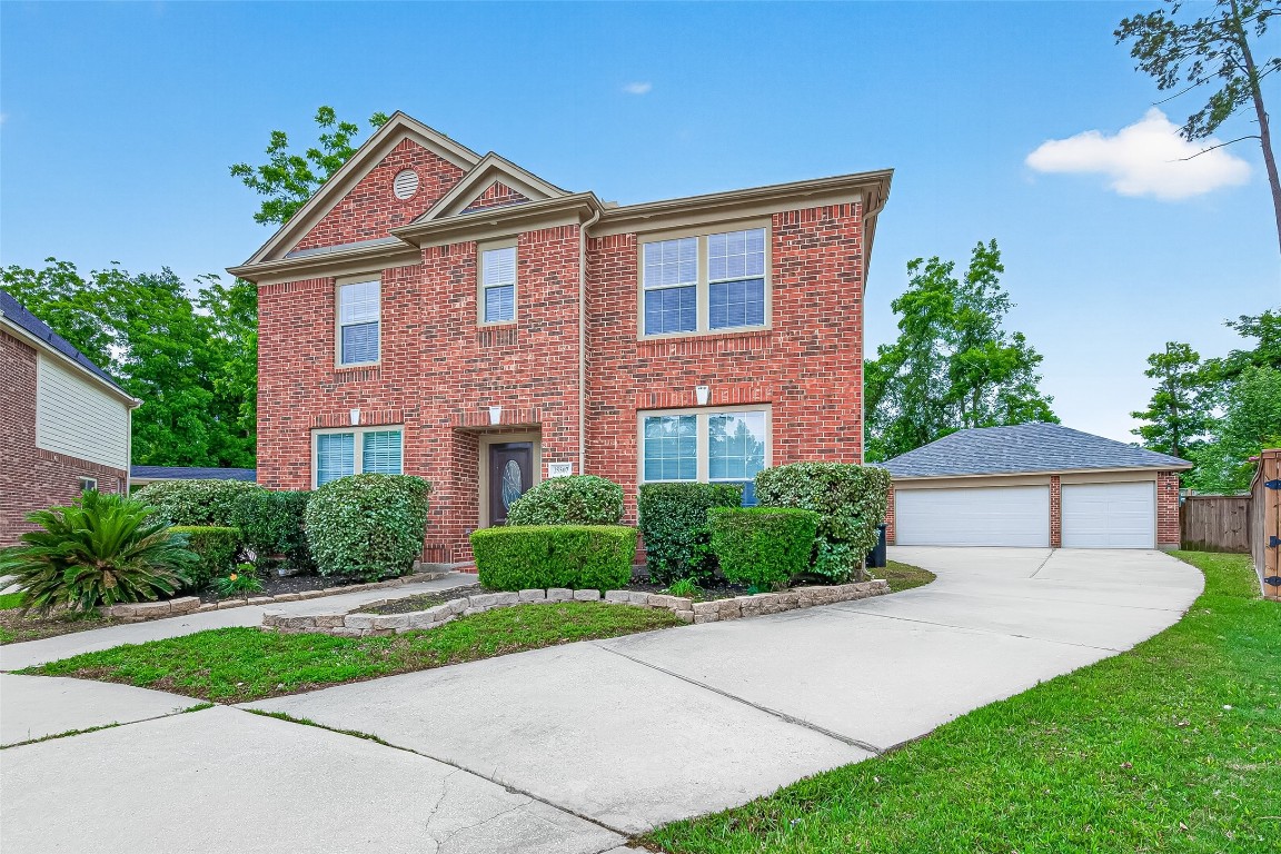 25507 Lyon Springs Court Spring, TX 77373 - Photo 2 of 39 a front view of a house with yard and green space