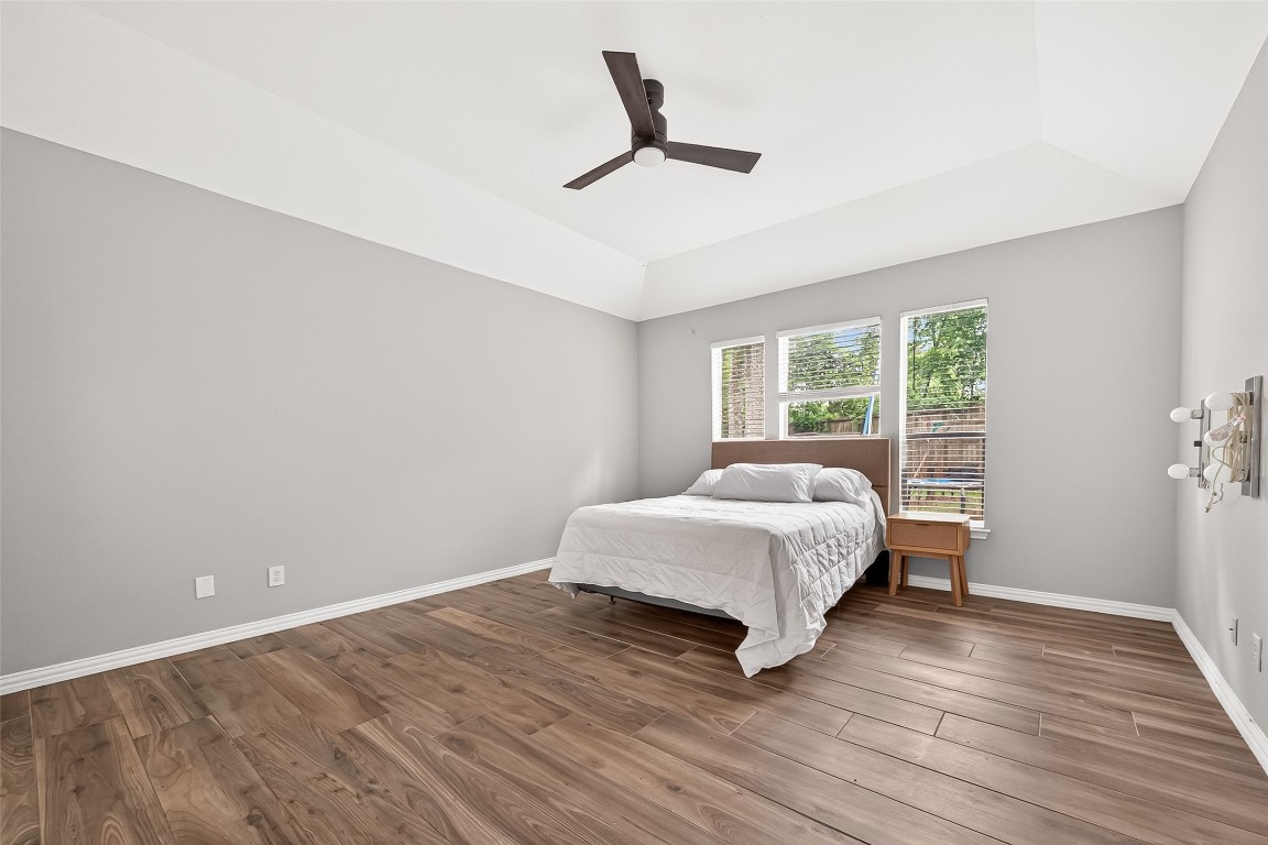 25507 Lyon Springs Court Spring, TX 77373 - Photo 21 of 39 a bedroom with a bed and a window