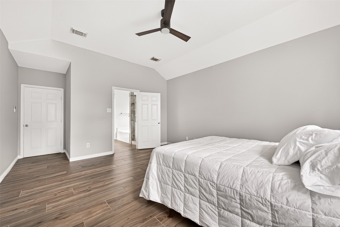 25507 Lyon Springs Court Spring, TX 77373 - Photo 22 of 39 a bedroom with a bed and wooden floor