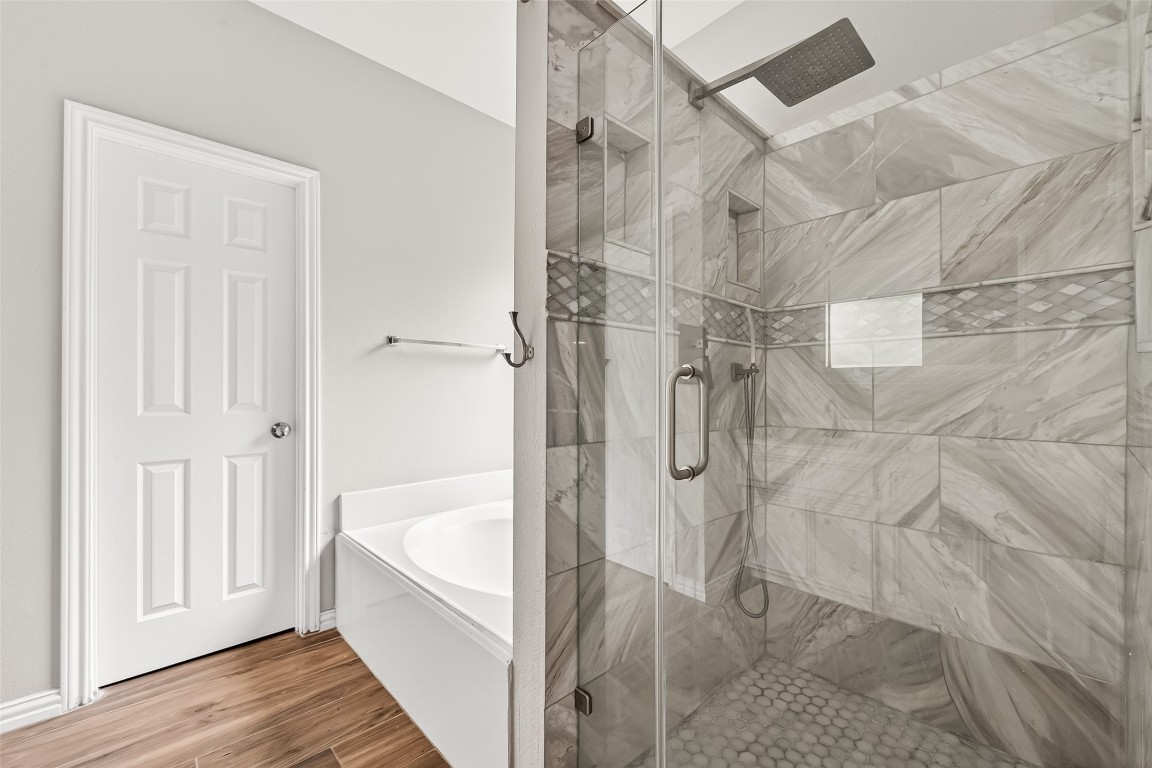 25507 Lyon Springs Court Spring, TX 77373 - Photo 24 of 39 a bathroom with a bathtub and shower