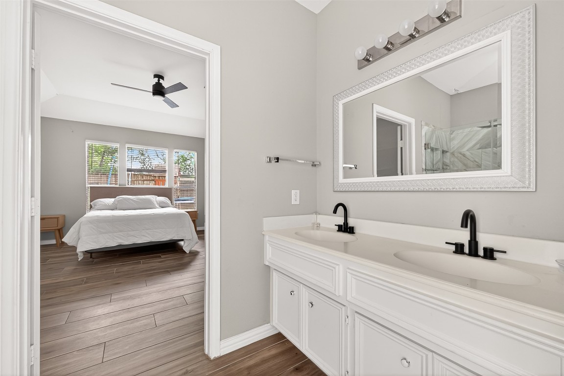 25507 Lyon Springs Court Spring, TX 77373 - Photo 25 of 39 a en suite bathroom with a double vanity sink and a window